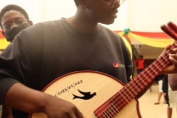 A student plays a traditional Chinese musical instrument at an exhibition of the Chinese culture week in the University of Cape Coast in Cape Coast, Ghana