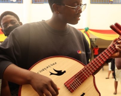 A student plays a traditional Chinese musical instrument at an exhibition of the Chinese culture week in the University of Cape Coast in Cape Coast, Ghana