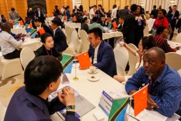 People at the China-Tanzania Investment Forum and China (Jinhua)-Tanzania Trade and Investment Promotion Conference in Dar es Salaam, Tanzania