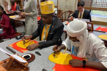  African representatives taking part in a calligraphy workshop.
