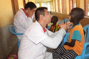 Doctors from the 12th Chinese medical team examines a child at the Juba Orphanage in Juba, South Sudan