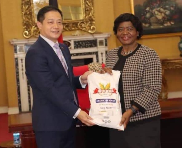 Wang Hao, charge d'affaires of the Chinese Embassy with Lady Monica Chakwera
