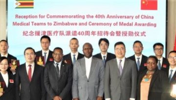 Members of the Chinese medical team pose for a group photo with Chinese and Zimbabwean officials at the Chinese embassy in Harare, Zimbabwe