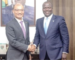 Tong Defa (left), Chinese Ambassador to Ghana, exchanging pleasantries with Samuel Abu Jinapor, Minister of Lands and Natural Resources
