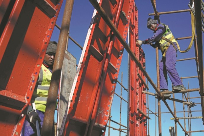 Workers at the third-phase road project of Namibia's capital international airport