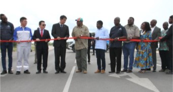 John Mutorwa (5th L), Namibia's deputy prime minister and minister of works and transport, and representatives from both China and Namibia, cut the ribbon at the official opening of the Chinese-constructed John Mutorwa Road in Rundu, Namibia
