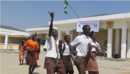 Local students dance in celebration of the opening of the China-built Jubek Model Secondary School, in Gudele, South Sudan. 