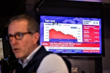 A trader works on the floor of the New York Stock Exchange in New York, the United States