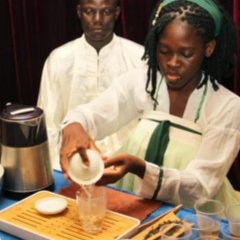 A student from the Confucius Institute performs Chinese tea art at the Chinese Cultural Center in Cotonou, Benin