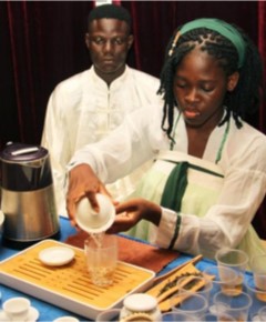 A student from the Confucius Institute performs Chinese tea art at the Chinese Cultural Center in Cotonou, Benin