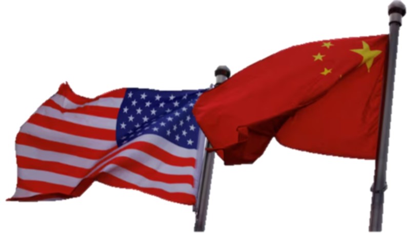 Chinese and U.S. flags flutter are seen outside the building of an American company in Beijing