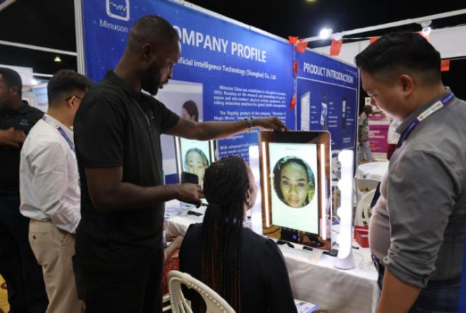 A woman tries an AI checkup product at the China-West Africa Medical and Health Industry Expo in Accra, Ghana