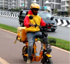 A delivery man rides an electric bicycle in Addis Ababa
